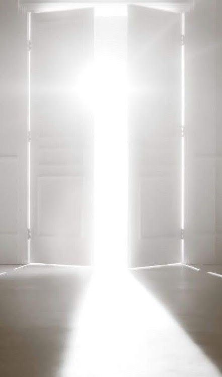 White double doors opening into brilliant light